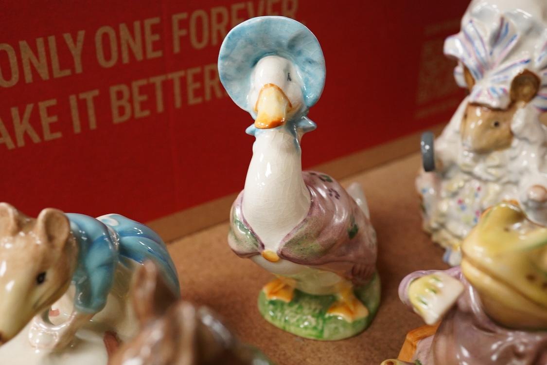 Nineteen Beatrix Potter character stamped F Warne and Co, Beswick, 10cm
